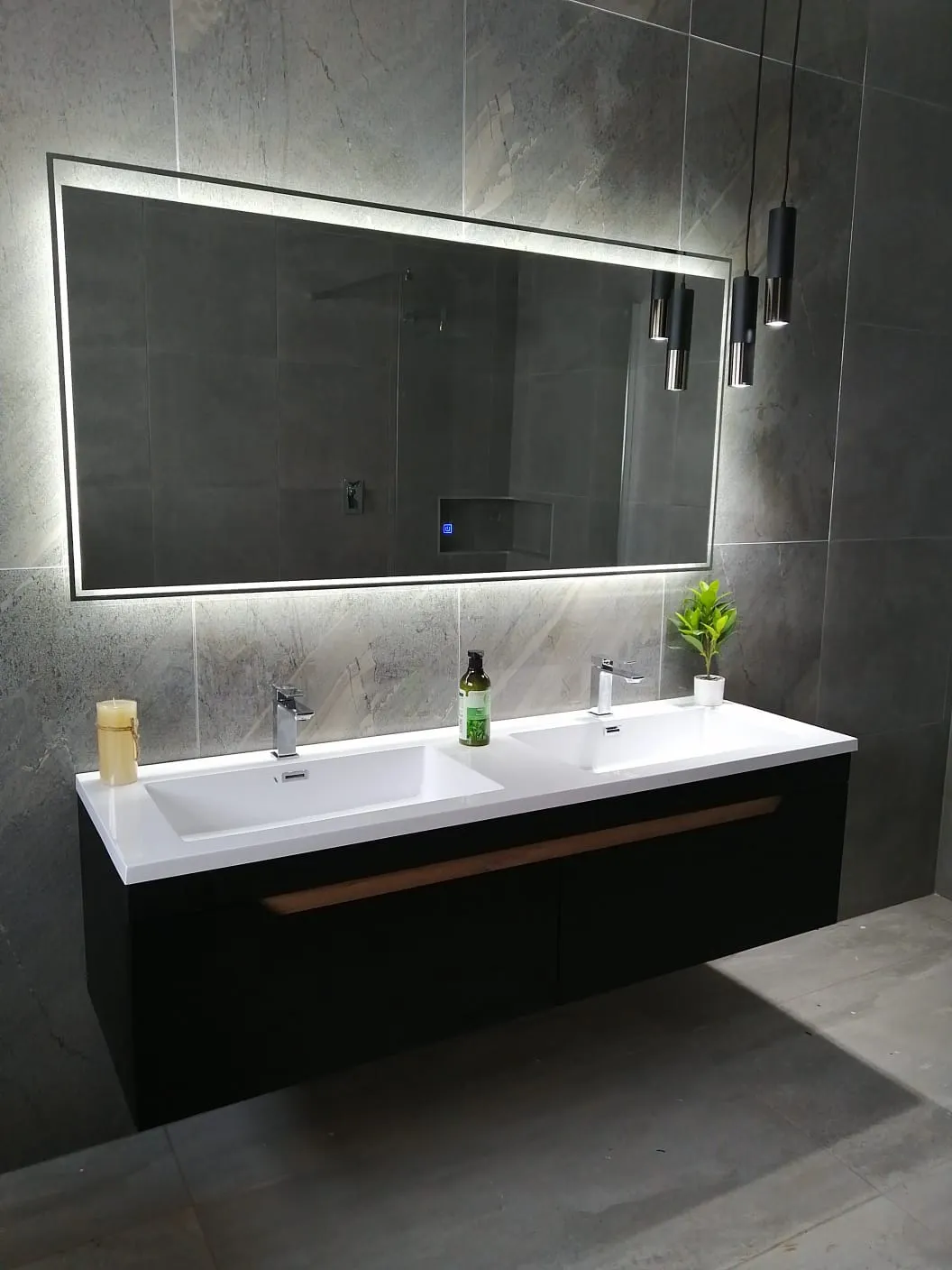 Floating black double vanity with a backlit LED mirror, by N.D.I.